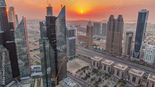 High-rise buildings on Sheikh Zayed Road in Dubai aerial timelapse during sunset, UAE. photo