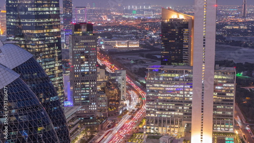 Skyline view of the high-rise buildings in International Financial Centre in Dubai aerial day to night timelapse, UAE.