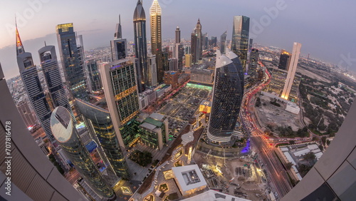 Skyline panorama of the high-rise buildings on Sheikh Zayed Road in Dubai aerial day to night timelapse  UAE.