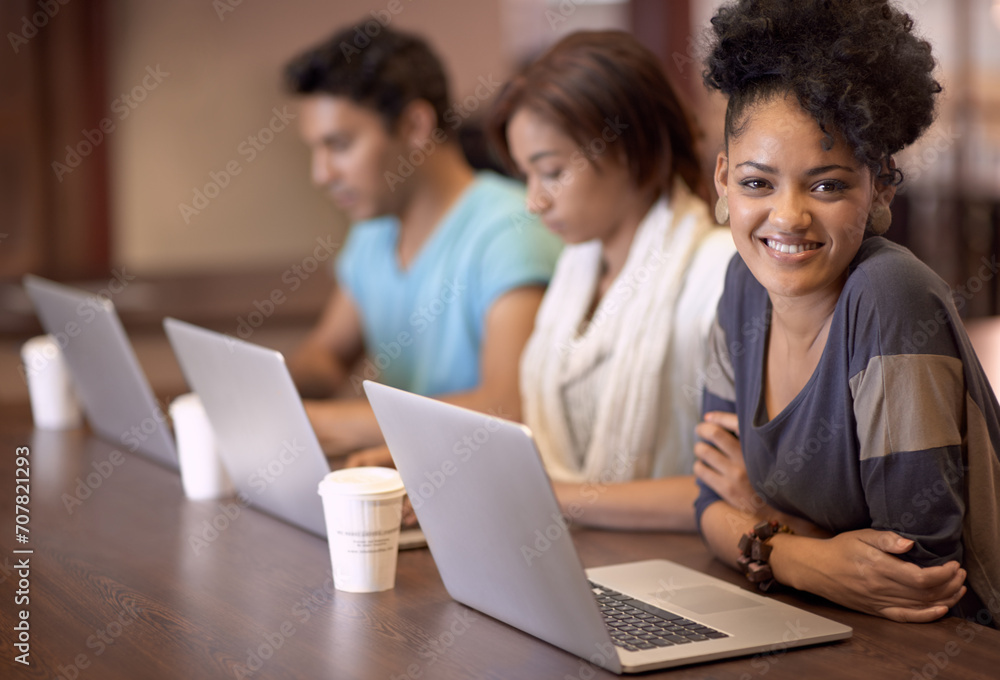 Laptop, happiness and portrait of college woman for online research, education and school scholarship. University, coworking space and students learning knowledge, information and studying together Laptop, happiness and portrait of college woman for online research, education and school scholarship. University, coworking space and students learning knowledge, information and studying together