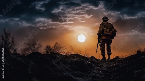 soldier against the backdrop of the full moon. military war with gun weapon participating and preparing to attack photo
