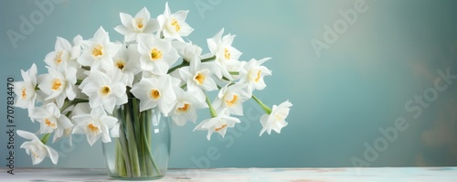 Bouquet of white narcissus on a slate colored backdrop isolated pastel background 