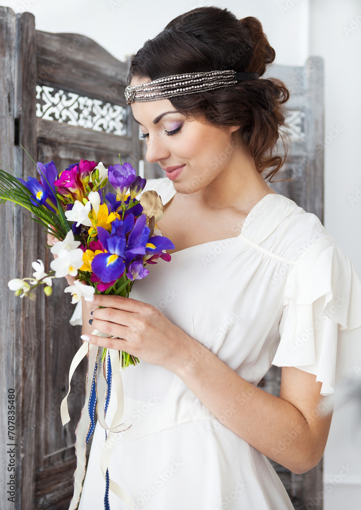 Beautiful bride with colorful wedding bouquet in her hands Beautiful bride with colorful wedding bouquet in her hands