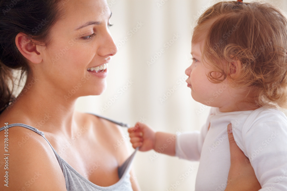 Mom holding baby girl in home with smile, bonding and child care with support in morning. Happy woman, toddler and playing together in bedroom with development, trust and safety with mothers love. Mom holding baby girl in home with smile, bonding and child care with support in morning. Happy woman, toddler and playing together in bedroom with development, trust and safety with mothers love.