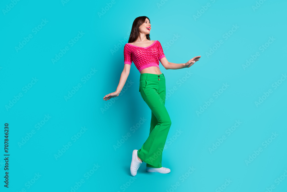 Photo of pretty lovely girl feel good mood enjoy spring holiday vacation isolated blue color background Photo of pretty lovely girl feel good mood enjoy spring holiday vacation isolated blue color background