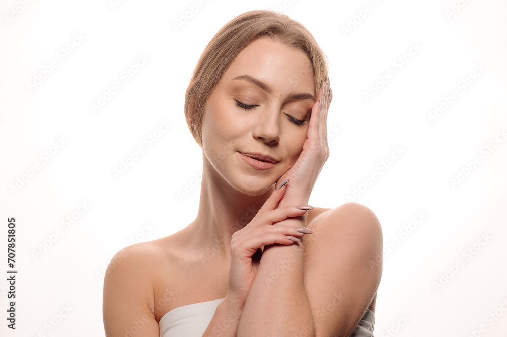 Beauty portrait of a pretty girl smiling on an isolated white background Beauty portrait of a pretty girl smiling on an isolated white background