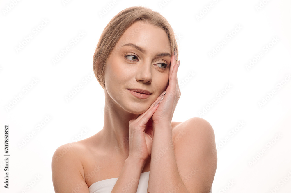 Beauty portrait of a beautiful girl on an isolated white background. Skin care concept. Cosmetology Beauty portrait of a beautiful girl on an isolated white background. Skin care concept. Cosmetology