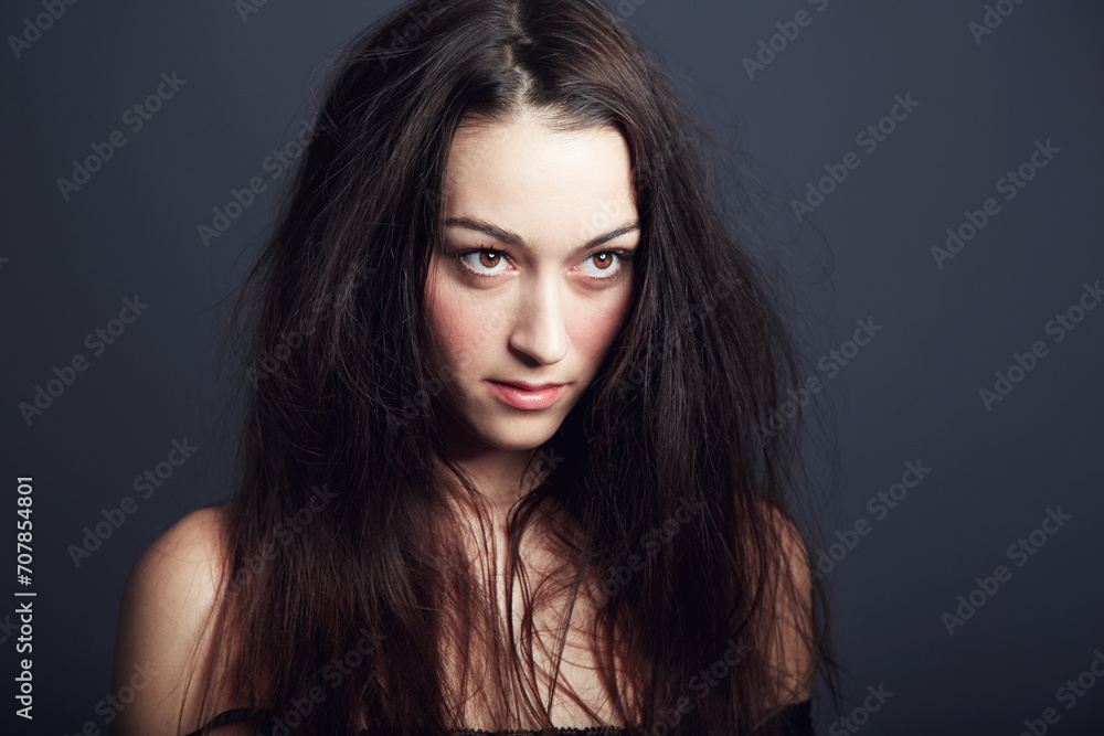 Woman, hair and beauty with confidence and cosmetic care in studio, wellness and long hairstyle on dark background. Empowered, fierce and edgy with young model and texture, growth and salon treatment Woman, hair and beauty with confidence and cosmetic care in studio, wellness and long hairstyle on dark background. Empowered, fierce and edgy with young model and texture, growth and salon treatment