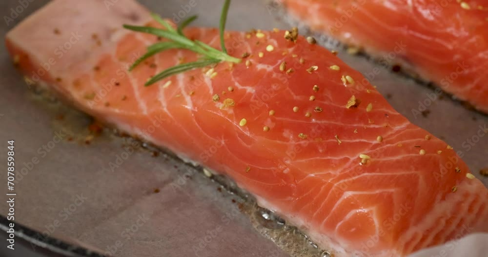 Slow motion video of pieces of trout are fried in a pan Slow motion video of pieces of trout are fried in a pan