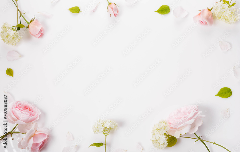 Festive flower composition on white background. Overhead view, flat lay, frame