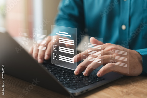 businessman using a laptop. online survey with digital forms and checklists. technology and strategy for success in the business modern world. efficiency, Transparency in organizations and companies