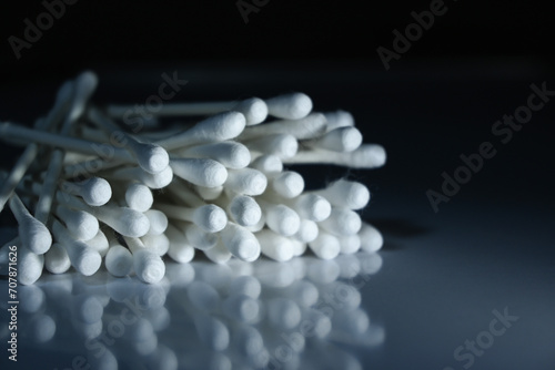 cotton swabs isolated on black photo