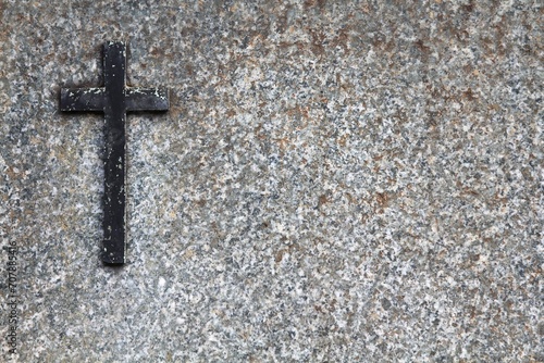 Granite gravestone with a cross