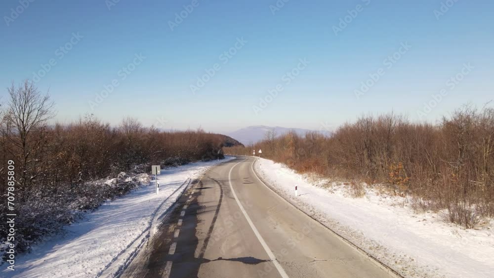 Travel journey transport and vacation concept High angle aerial view drone video on the road in mountain range with white snow in winter day near Knjazevac in Serbia nobody empty Travel journey transport and vacation concept High angle aerial view drone video on the road in mountain range with white snow in winter day near Knjazevac in Serbia nobody empty