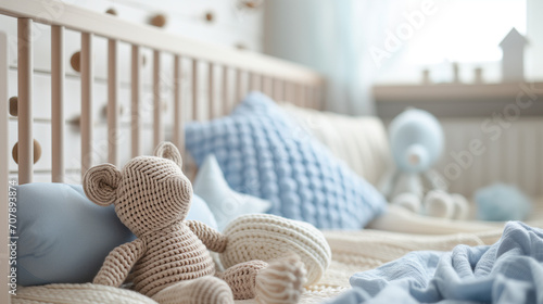 A blue nursery bedroom for a baby boy with tones of beige, baby cot or crib and teddy, decor, bed, pregnancy, baby, newborn, toddler, motherhood photo