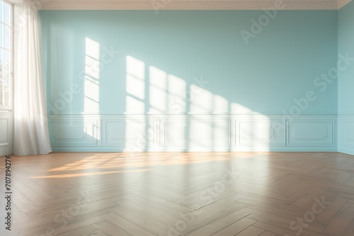 Light aquamarine wall and wooden parquet floor  sunrays and shadows from window
