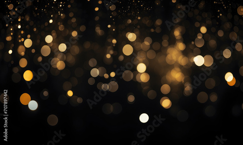 Dark bookeh background with soft focus golden lights. Festive abstract wallpaper 