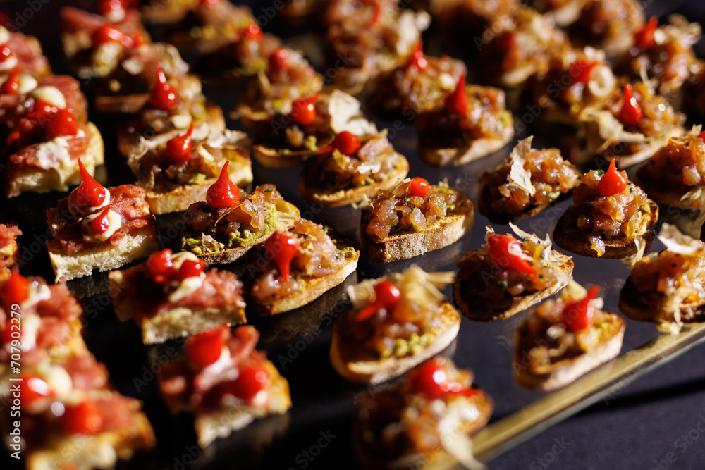 A set of small different snacks. Bite-sized catering canapes.