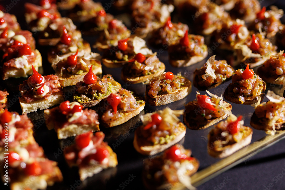 A set of small different snacks. Bite-sized catering canapes. A set of small different snacks. Bite-sized catering canapes.