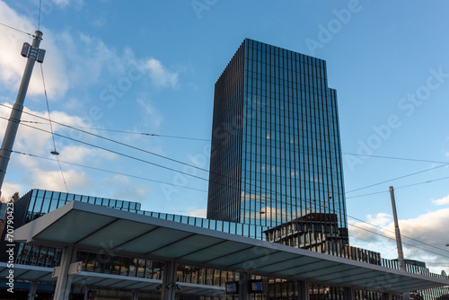 Modern high-rise building made of glass and concrete near the train station in St. Gallen