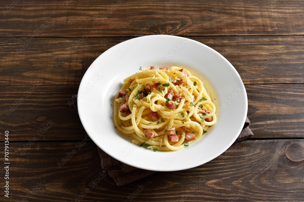 Carbonara pasta, spaghetti with crisp pancetta and black pepper