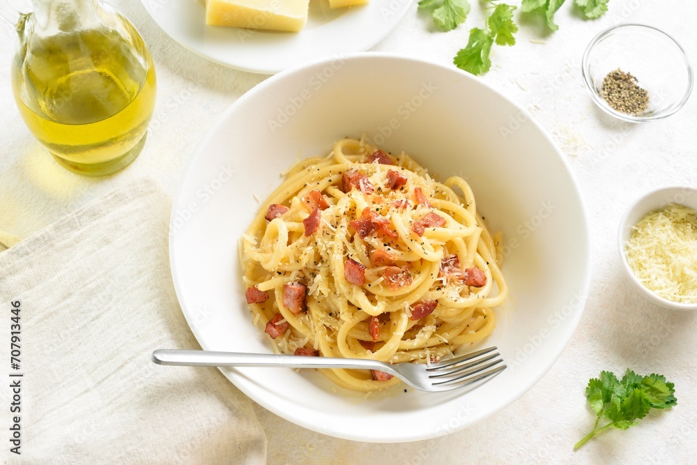 Italian pasta dish with crisp pancetta bacon, parmesan cheese and black pepper. Italian pasta dish with crisp pancetta bacon, parmesan cheese and black pepper.
