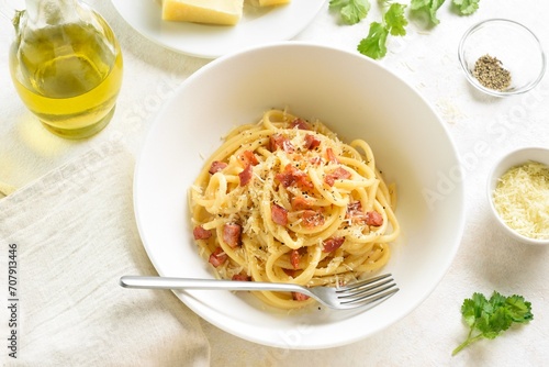 Italian pasta dish with crisp pancetta bacon, parmesan cheese and black pepper.