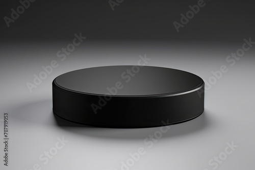 Close-up view of an isolated black rubber puck in hockey.