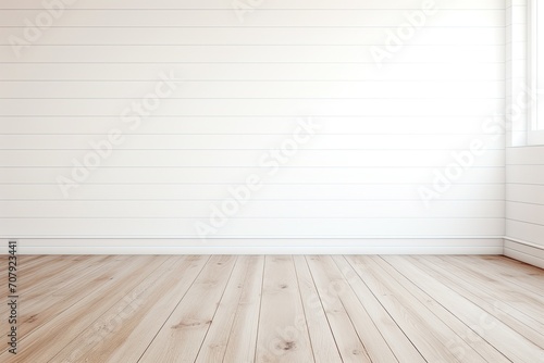 White-walled room with wooden flooring.