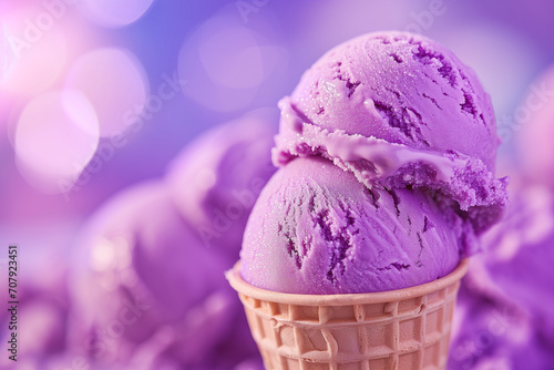 Blueberry ice cream with mint in waffle cone. Close-up. Purple ice cream. purple ice cream in a cup. Ice cream cone with pink, blue and purple ice cream. Various of Ice Cream Flavor. Summer Concept.