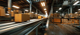 Cardboard boxes move along the conveyor system in the warehouse