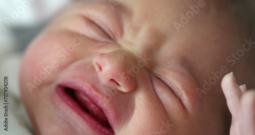 Cute newborn baby infant crying photo