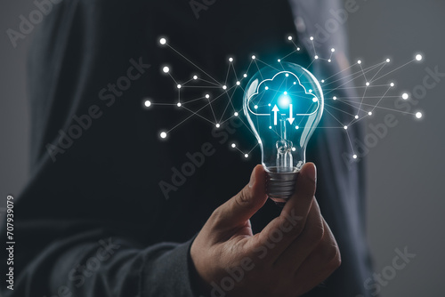 A man hand holding Light bulb Global Internet connection. Business global internet connection application cloud big data technology and digital marketing, Financial and banking, Digital link tech.