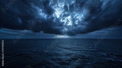 Black-blue sky, ghostly clouds, and a foreboding ocean, evoking mystery and darkness