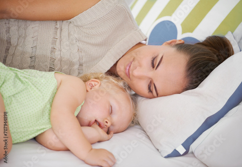 Love, sleeping and mom with baby on bed for bonding, relax and sweet cute relationship. Happy, smile and young mother watching girl child, kid or toddler taking a nap in bedroom or nursery at home.