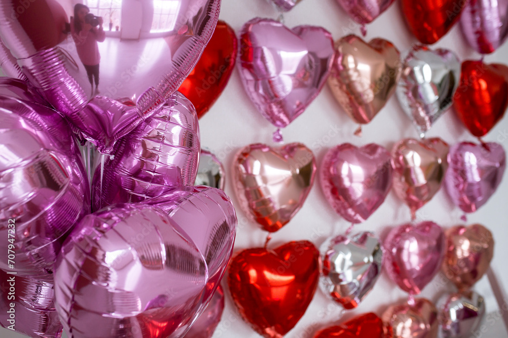 Festive decorations for Valentine's day, wedding or hen party. Love sign and heart shape balloons on white background. Festive decorations for Valentine's day, wedding or hen party. Love sign and heart shape balloons on white background.