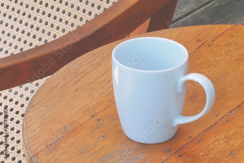 Close up a plain white ceramic mug on wooden table , relax, drink, food, americanos, espresso, arabica, robusta, caffeine, tea, holiday  © Nattakarn