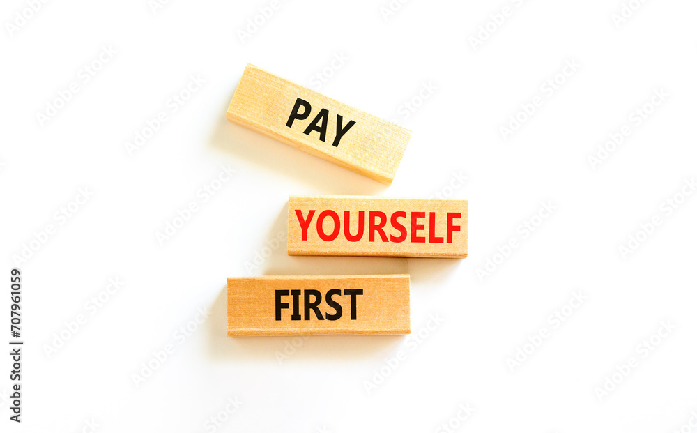 Pay yourself first symbol. Concept words Pay yourself first on beautiful wooden blocks. Beautiful white table white background. Business and pay yourself first concept. Copy space. Pay yourself first symbol. Concept words Pay yourself first on beautiful wooden blocks. Beautiful white table white background. Business and pay yourself first concept. Copy space.