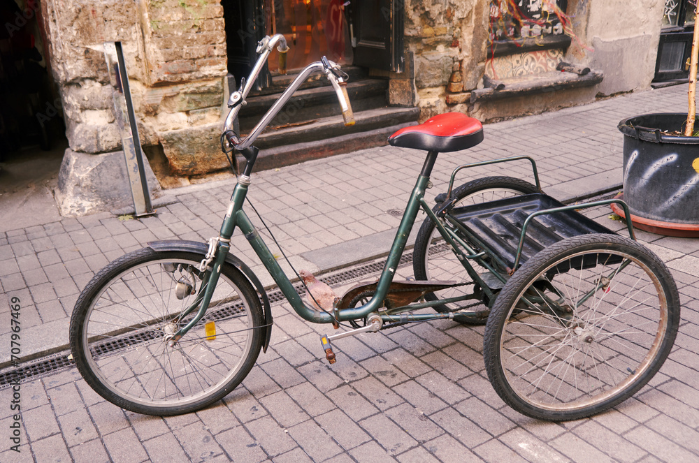 Vintage adult tricycle bike: A classic three-wheeled bicycle with timeless charm, evoking nostalgia and showcasing the enduring elegance of a bygone era.
