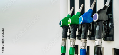 Gas station. Pistols with gasoline and diesel fuel at a car gas station. Oil business and transportation costs