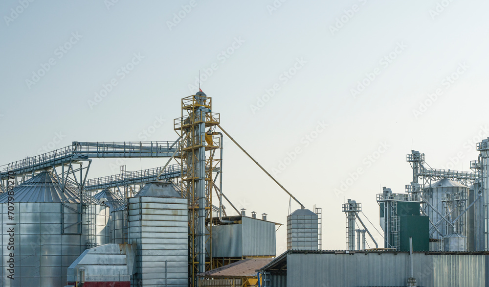 Agricultural silos for storage of grain harvest at an agricultural production farm