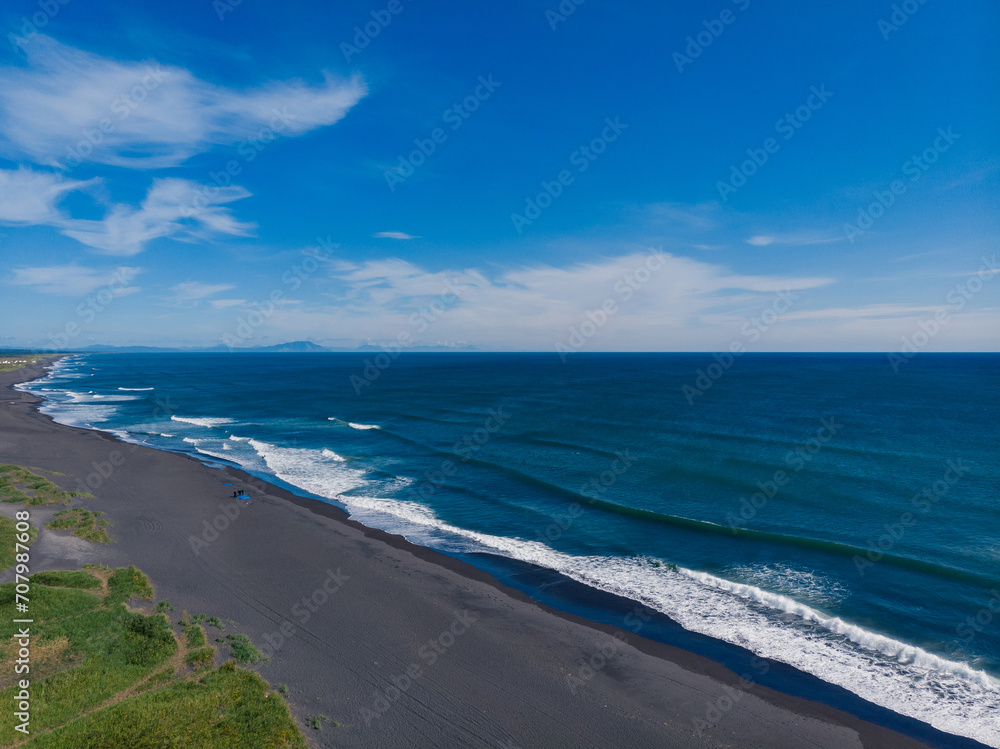 Beautiful nature Landscape of Khalaktyrsky beach with black volcanic sand coast of North Pacific Ocean Kamchatka Russia, aerial top view