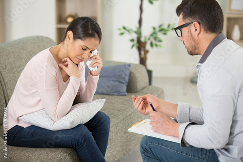 tearful woman talking to a therapist
