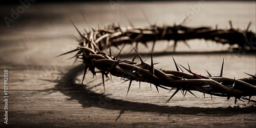 A crown of thorns is placed on a table. Suitable for religious or symbolic concepts photo