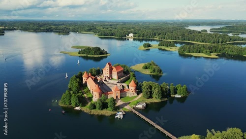 Aerial drone shot of red brick medieval castle on island in Trakai, Vilnius region, Lithuania. Trakai castle medieval gothic Island castle located in Galve lake. Most beautiful Lithuanian landmark