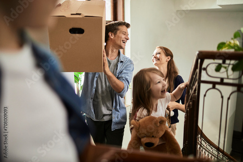 Young family moving in their new home together photo