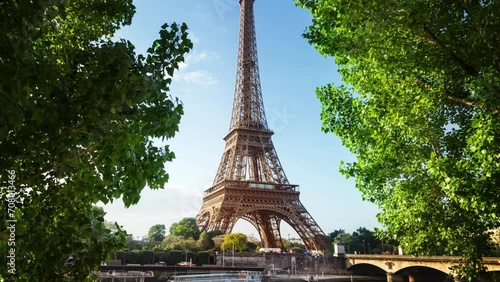 Eiffel Tower. People on Champ de Mars. World famous symbol of Paris at sunset. Popular tourist destination.
 photo