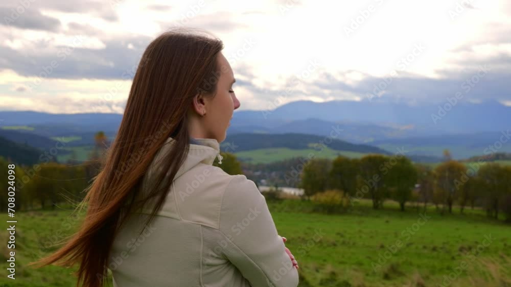 girl in the mountains thoughtfully examines nature girl in the mountains thoughtfully examines nature