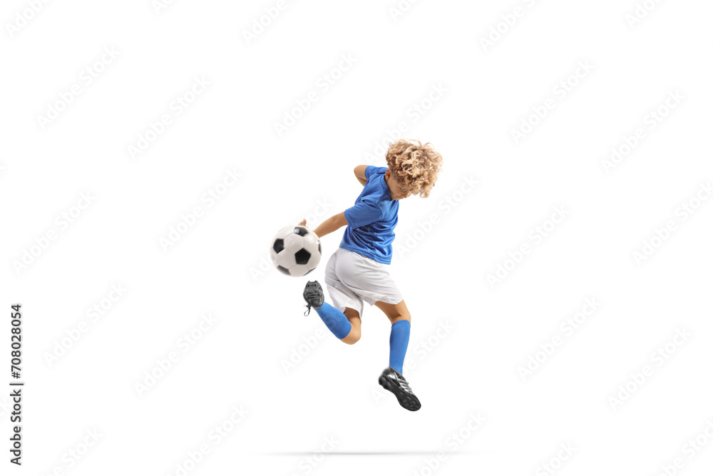 Boy kicking a football with backheel Boy kicking a football with backheel