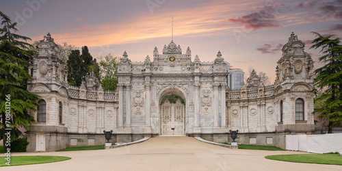 Sunset shot of closed gate leading to former Ottoman Dolmabahce Palace, or Dolmabahce Sarayi, suited in Ciragan Street, Besiktas district, Istanbul, Turkey. View from the internal court photo